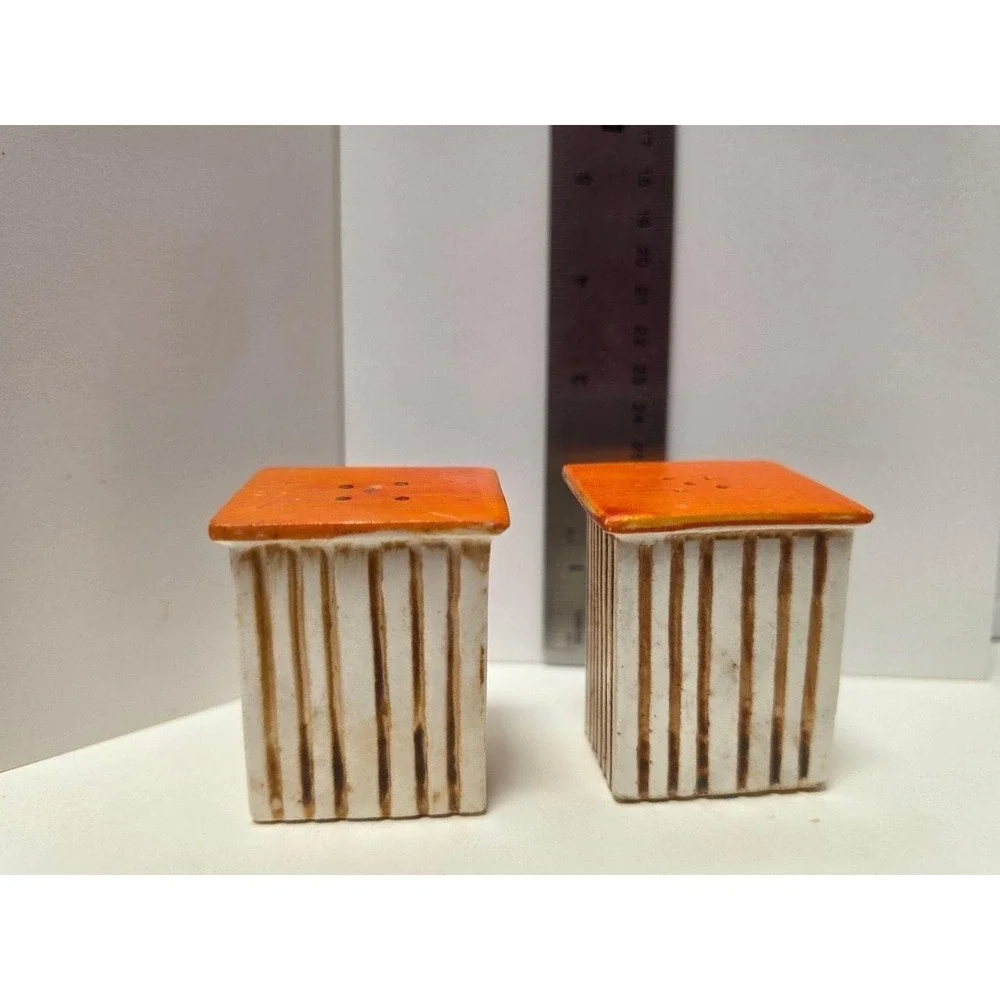 vintage, comical salt and pepper shakers feature an outhouse design with humorou